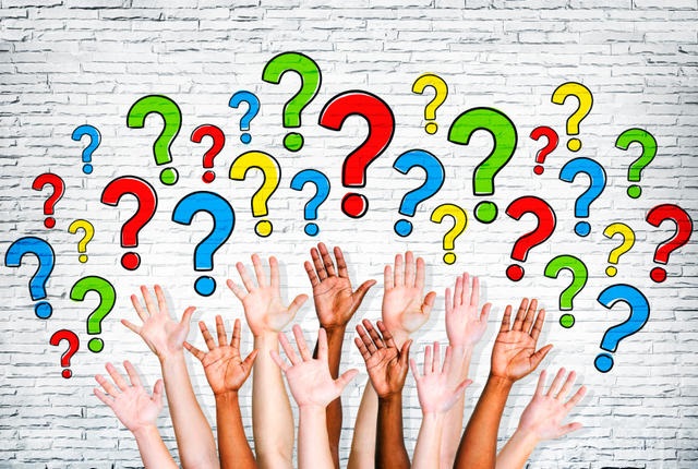 Multi-Ethnic Arms Outstretched To Ask Questions